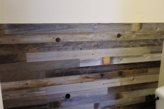 Salvaged barn wood plank wall