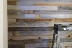 Salvaged barn wood plank wall