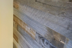 Salvaged barn wood plank wall